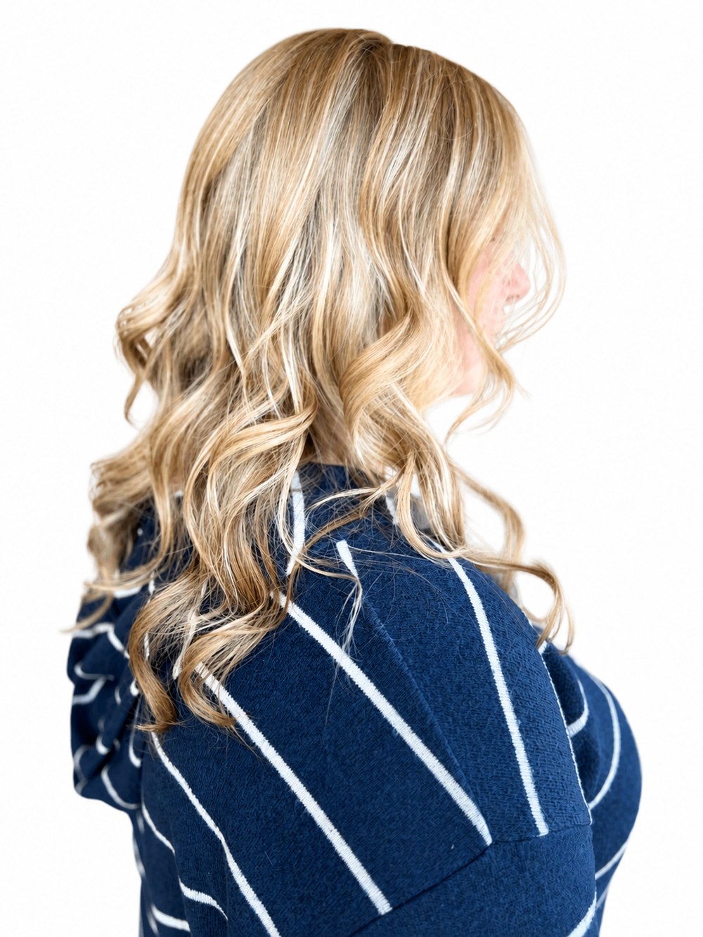 Long wavy blonde highlights with soft dimension, hair color by Aubree at Blonde Faith in Carrollton, GA