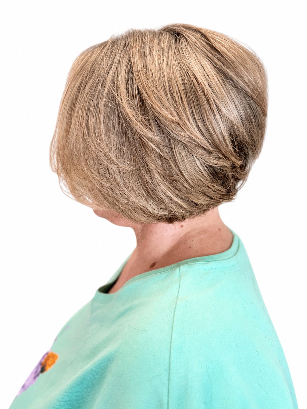 Short blonde bob with dimensional color and soft graduated layers, styled by Aubree at Blonde Faith